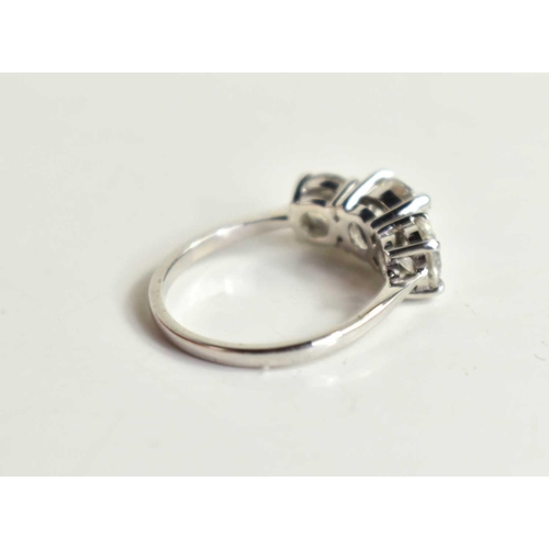 220 - An 18ct white gold and diamond trio ring, the three brilliant cut diamonds with central stone approx... 