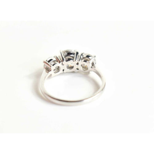 220 - An 18ct white gold and diamond trio ring, the three brilliant cut diamonds with central stone approx... 