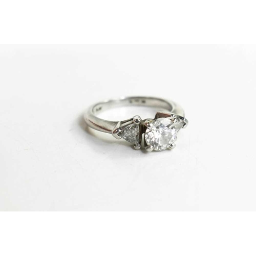 221 - A platinum and diamond ring, composed of a central brilliant cut 1ct diamond, VS1, colour E, flanked... 