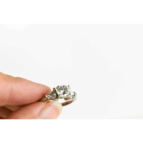 221 - A platinum and diamond ring, composed of a central brilliant cut 1ct diamond, VS1, colour E, flanked... 