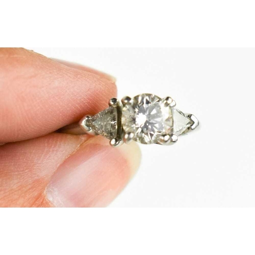 221 - A platinum and diamond ring, composed of a central brilliant cut 1ct diamond, VS1, colour E, flanked... 