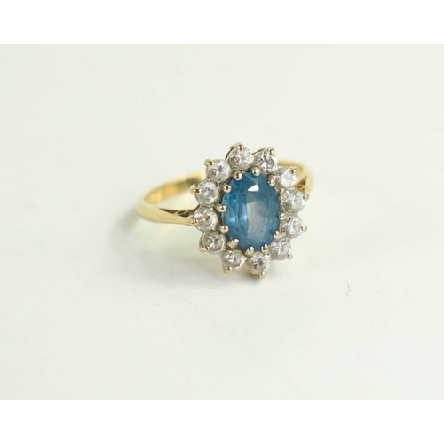 236 - A 9ct gold dress ring set with blue and white paste, size N, 2.4g.