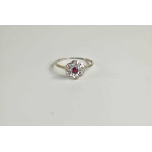 241 - A white gold, diamond and ruby flowerhead ring, white gold unmarked but testing as at least 9ct, siz... 