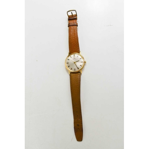 252 - A vintage Omega wristwatch with a tan leather strap.