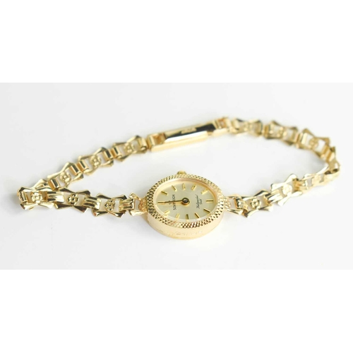 256 - A 9ct gold Sovereign cocktail watch the signed champagne dial with baton numerals, on a 9ct gold bow... 