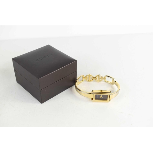 257 - A vintage Gucci mood watch, the signed rectangular dial changes colour from black, through shell pin... 