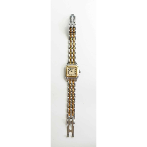 261 - A Cartier bi-colour tank wristwatch, the square signed face with Roman numerals and minute track, wi... 