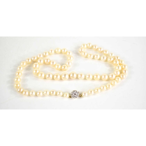 57 - An antique cultured pearl necklace with 9ct gold clasp set with paste stones in flowerhead form, gra... 