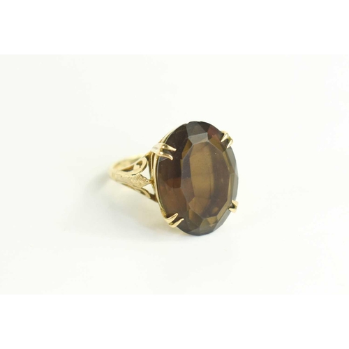 63 - A 9ct gold and quartz dress ring, the 19th century style raised and pierced setting set with oval cu... 