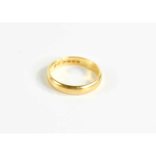 64 - A 22ct gold wedding band, size L, 3.8g.