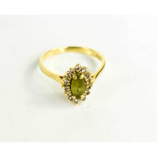 72 - An 18ct gold, diamond and peridot ring, the marquise cut peridot approximately 1ct, size N/O, 3g.