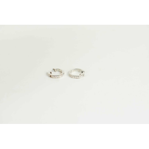 83 - A pair of 9ct white gold and diamond earrings, unmarked but testing as at least 9ct, of octagonal fo... 