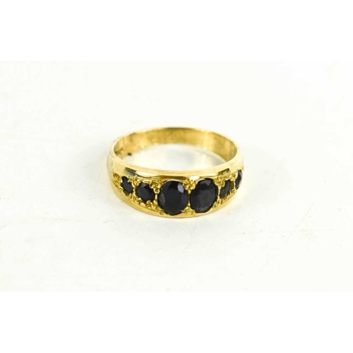 92 - A 9ct gold and sapphire six stone ring, size O, 3.10g.