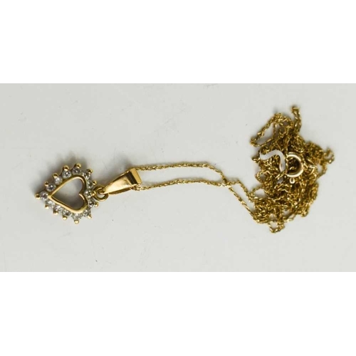 95 - A 9ct gold and diamond heart shaped pendant, set with fourteen diamond brilliants, with very fine 9c... 