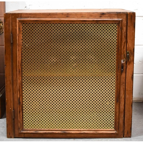 A 20th century wooden meat safe, with metal frille to the single door ...