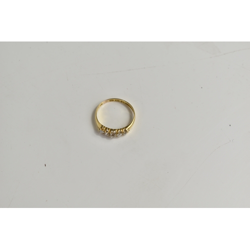 208 - An 18ct gold, and diamond five stone ring, the central diamond of approximately 4mm diameter, total ... 