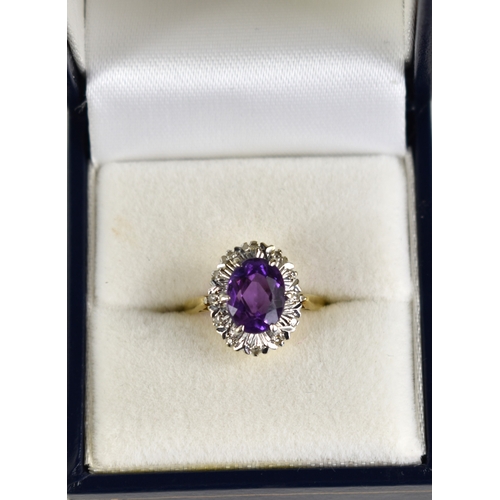 158 - An 18ct gold, amethyst and diamond set ring, the oval cut amethyst of approximately 9.3 by 6.63mm su... 