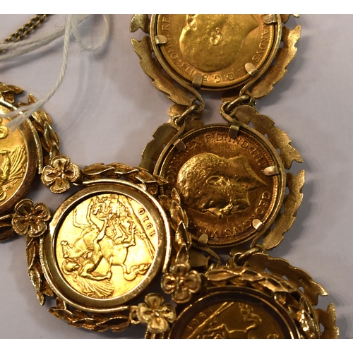 219 - A 9ct gold bracelet set with six half sovereigns, in a pretty laurel leaf and flowerhead setting to ... 