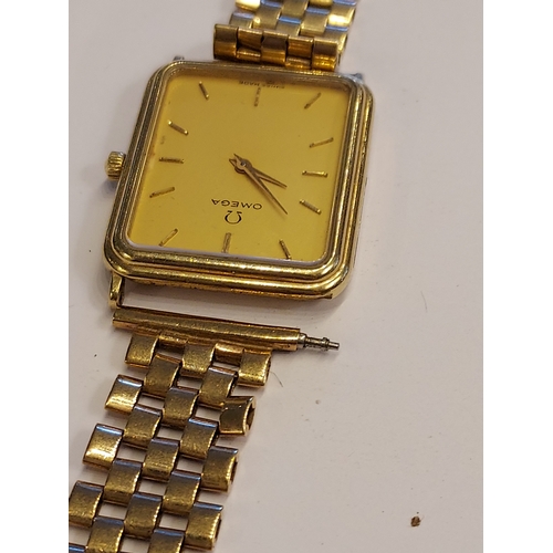249 - A gentleman's 9ct gold cased Omega dress watch, the signed champagne dial with baton numerals, with ... 