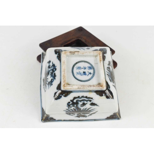 10 - A Qing Dynasty Chinese blue and white square form bowl, depicting phoenix to the sides and interior,... 