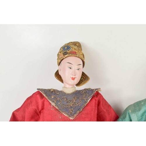 101 - Two Japanese late 19th century Emperor & Empress dolls, the Emperor with crowned headdress, both wea... 