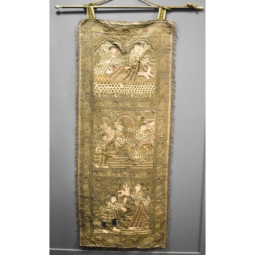 107 - A 19th century Indonesian silk embroidered wall hanging, sewn with metallic threads and embellished ... 