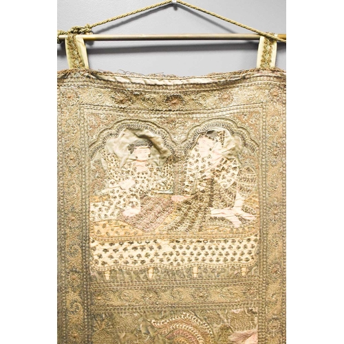 107 - A 19th century Indonesian silk embroidered wall hanging, sewn with metallic threads and embellished ... 