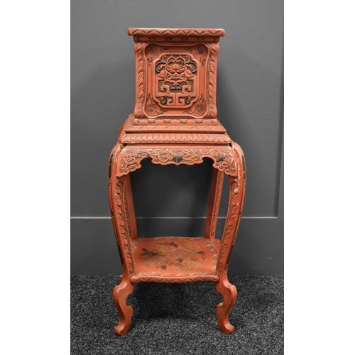 110 - A vintage Chinese red lacquered jardiniere stand, carved with stylised floral decoration throughout,... 