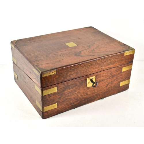 125 - A Victorian rosewood writing box with brass mounts, the fitted interior having a green leather skive... 