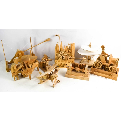 126 - A selection of handmade wooden mechanical models, to include gentleman playing a piano, aeroplane, m... 