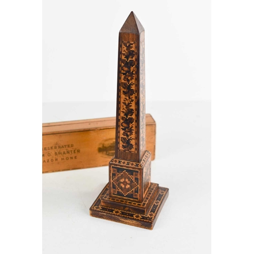 130 - A Mauchline ware Tam O Shanter razor hone, together with a 19th century Tunbridge ware obelisk form ... 