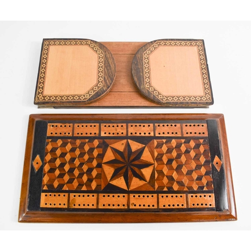 134 - A 19th century Tunbridge ware bookslide, together with a cribbage board inlaid with tumbling block p... 