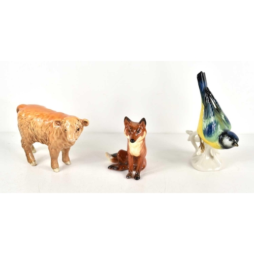 139 - A Beswick fox and bull ornament together with a continental porcelain blue tit.