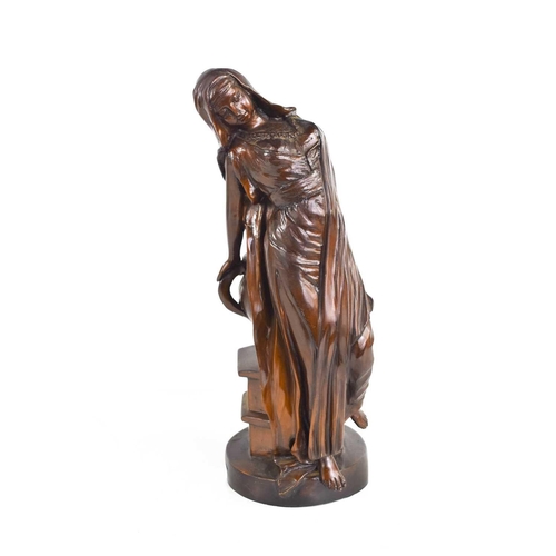 146 - A 20th century bronzed metal figure of a lady reclining against an urn, 30cm high.