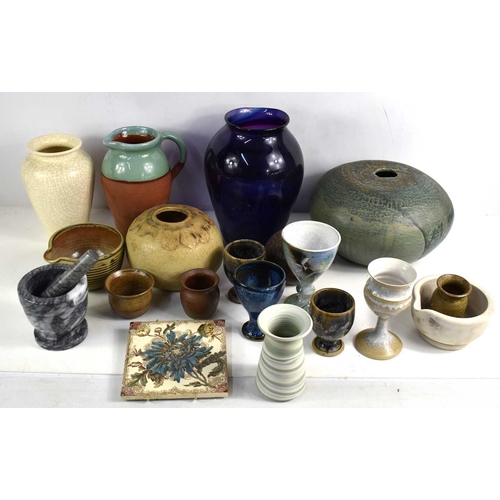 149 - A group of Studio pottery and ceramics to include a green glazed squat form vase, two small goblets ... 