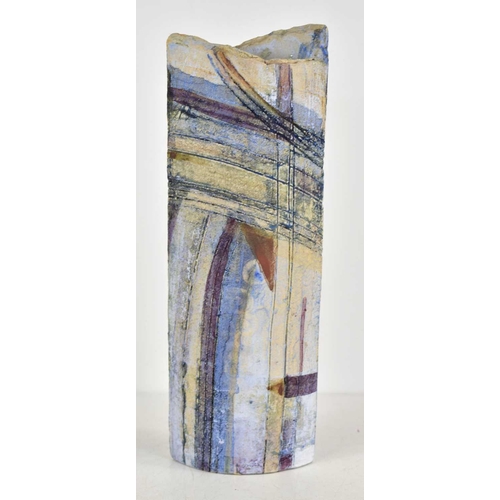 150 - A studio pottery slab form vase with polychrome underglaze and abstract designs, 29.5cm tall.