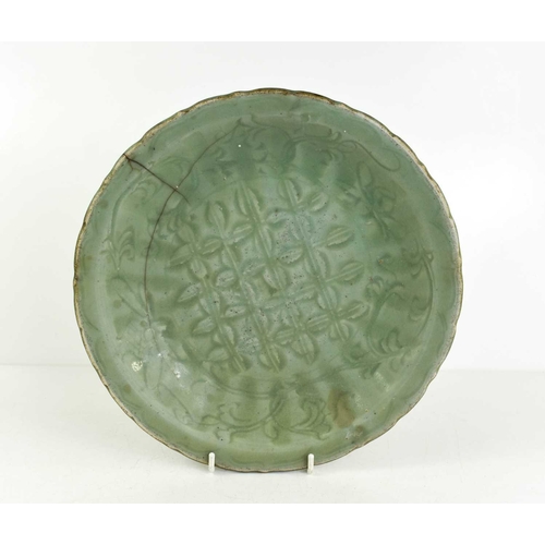 16 - A 'Longquan' celadon charger, with diaper and floral centre, signed to the base, sturdily-potted, th... 