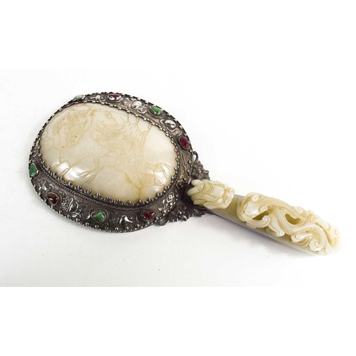 26 - A Qing Dynasty (1644-1912) Chinese white metal and jade hand mirror, comprising a large openwork bel... 