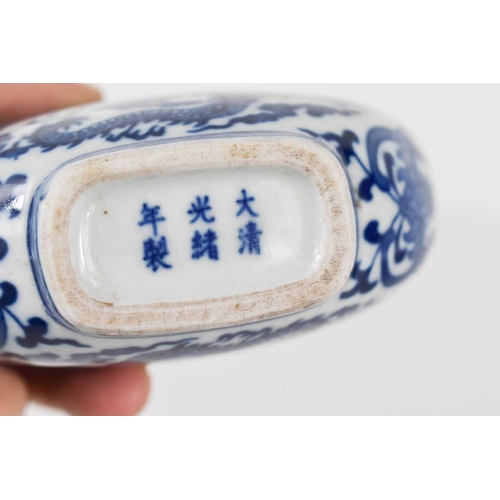 3 - A Chinese blue and white porcelain moon flask of small proportions, decorated with five claw writhen... 