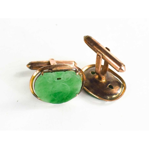 30 - A pair of Chinese 14ct gold and jade cufflinks, the jade plaques carved with Chinese symbols, 2.3cm ... 