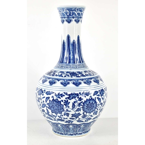 41 - A 20th century Chinese blue and white vase decorated with lotus blossom and ruyi bands, with six cha... 