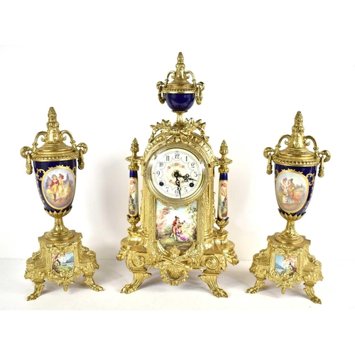 413 - A Franz Hermle clock garniture, the clock with twin train movement striking on a bell, the white dia... 