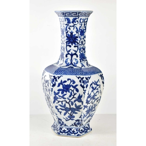 42 - A 20th century Chinese blue and white vase of hexagonal form decorated with lotus blossoms and repea... 