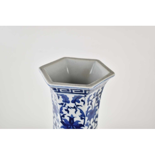 42 - A 20th century Chinese blue and white vase of hexagonal form decorated with lotus blossoms and repea... 