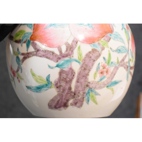 43 - A 19th century Chinese bottle form vase, depicting peaches and bats, 34cm high. There is a hole dril... 