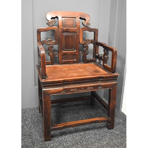 537 - A 19th century Qing dynasty throne chair, the open carved back with three fielded panels, scroll car... 