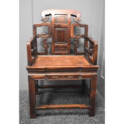 537 - A 19th century Qing dynasty throne chair, the open carved back with three fielded panels, scroll car... 