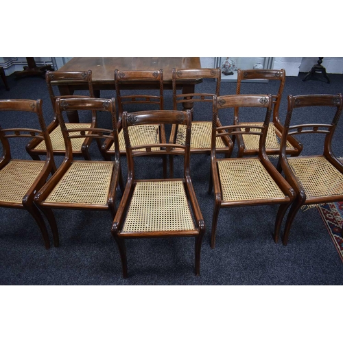 541 - A set of nine 19th century dining chairs with woven cane seats, turned back supports and sabre legs.