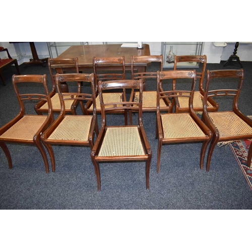 541 - A set of nine 19th century dining chairs with woven cane seats, turned back supports and sabre legs.