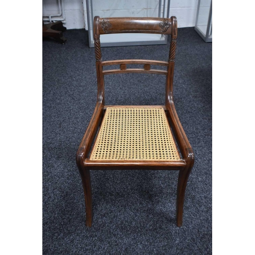 541 - A set of nine 19th century dining chairs with woven cane seats, turned back supports and sabre legs.